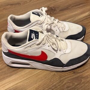Nike Men's White Sneakers with Red Swoosh and Charcoal Accents